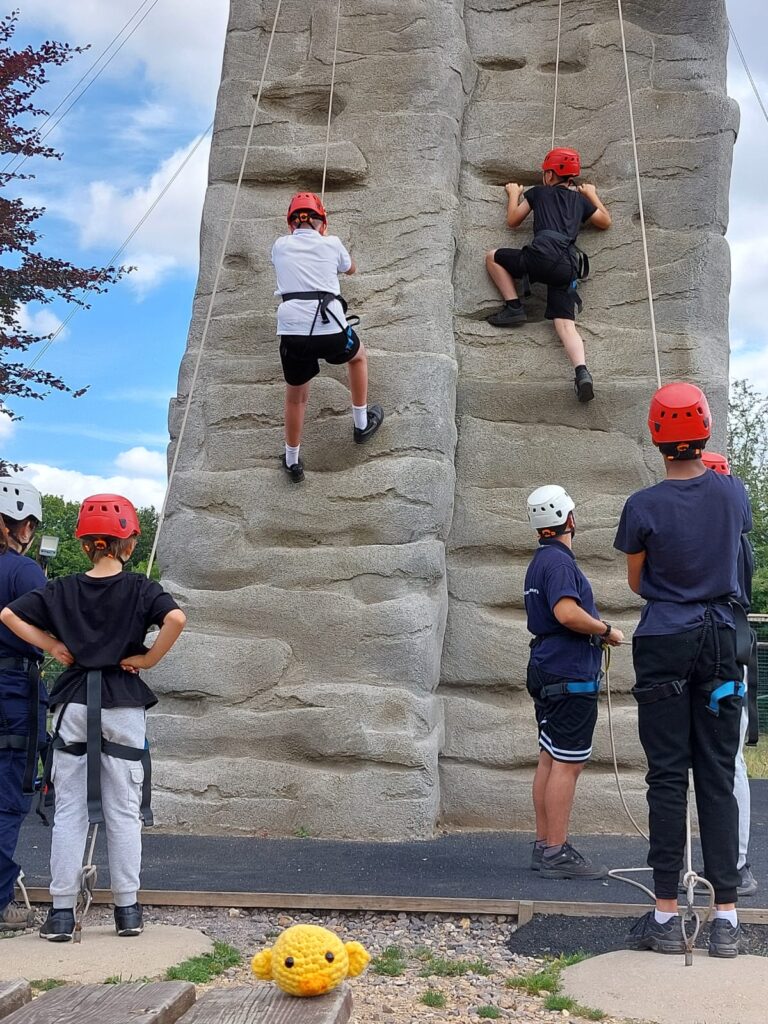 Young people rock climbing